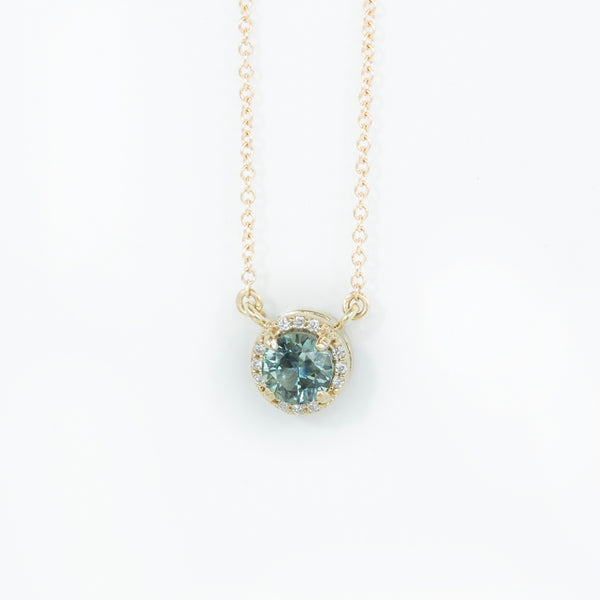 Madagascar Sapphire and diamond halo necklace in 14k gold