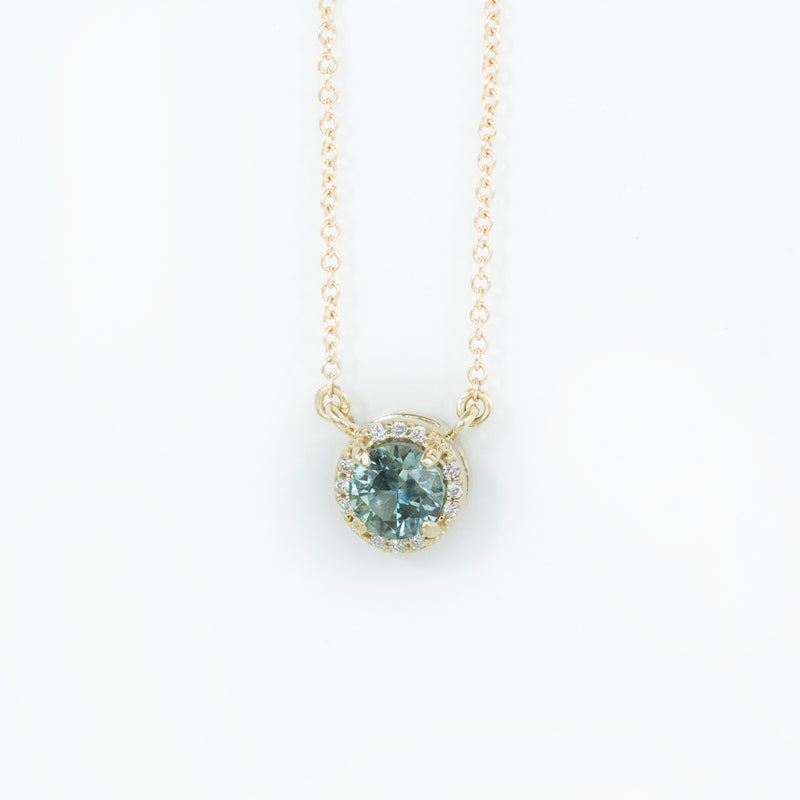 Madagascar Sapphire and diamond halo necklace in 14k gold