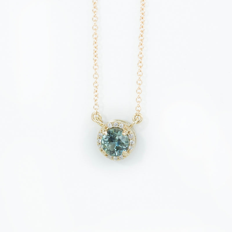 0.56ct Montana Sapphire and diamond halo necklace in 14k yellow