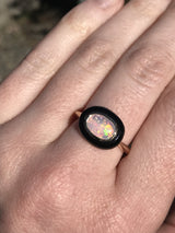 Opal and black jade cabochon ring in 14k Yellow Gold on hand